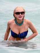 Lindsay Lohan oops boob slip in a bikini