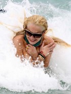 Lindsay Lohan oops boob slip in a bikini